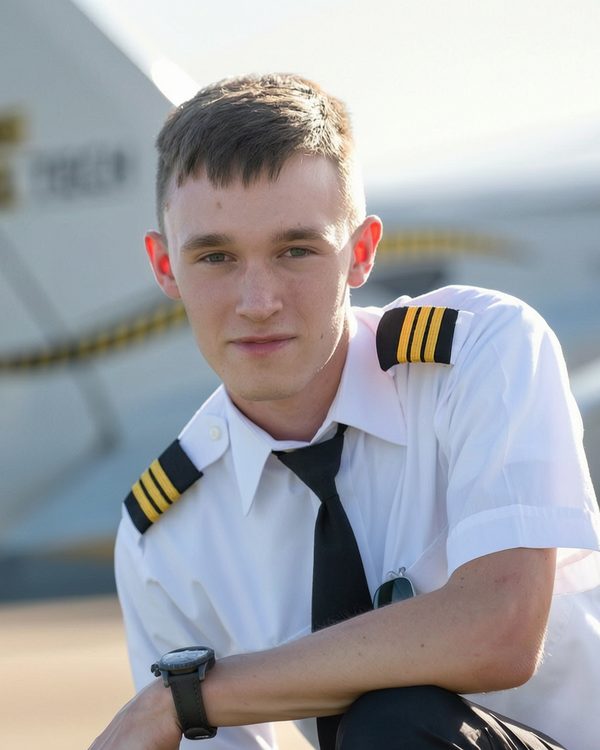 Sampson Smith in pilot uniform on the ramp